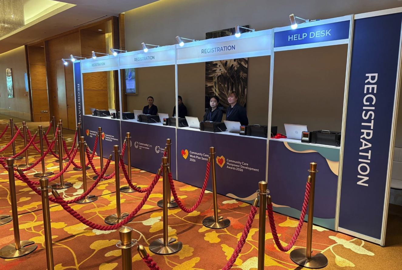 Registration desk setup at a corporate event in Singapore